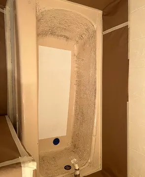 Bathtub surface preparation before professional reglazing in Queens