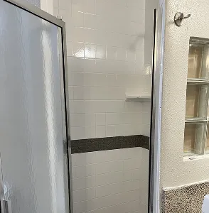 Freshly reglazed white shower with ceramic tile walls in Bronx