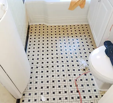 Professionally refinished bathroom mosaic tile floor in Bronx